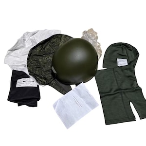 May include: An assortment of military gear, including an olive green helmet, a camouflage helmet cover, a white undershirt, black undergarments, a green balaclava, and green thermal bottoms. Several items have attached tags.