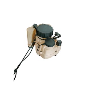 May include: A beige and dark green device with multiple compartments, knobs, and a cylindrical attachment. A black cord with a knot extends from the device. The device has a rounded shape and appears to be a piece of equipment.