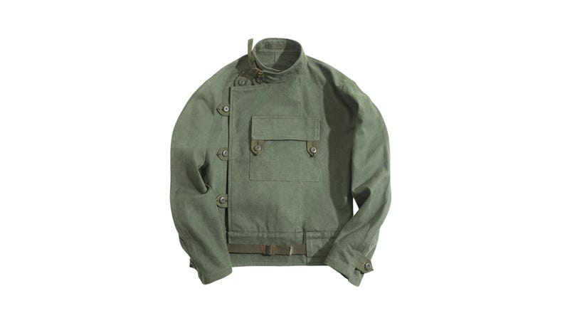 May include: Olive green jacket with a high collar and multiple button closures. Features a front pocket and a belt detail at the waist. The jacket has long sleeves and a tailored fit, suitable for outerwear.