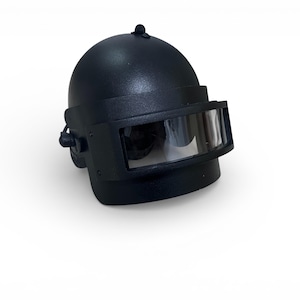 May include: A black helmet with a clear visor, likely for protection. The helmet has a rounded top and a rectangular visor. The helmet is made of a hard material and is designed to protect the head.