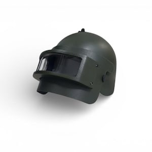 May include: A dark green military-style helmet with a visor. The helmet has a rounded top and a protective visor that covers the eyes. The helmet is designed to protect the head and face.