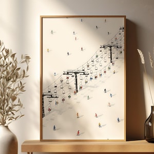 Könnte beinhalten: Ein gerahmter Kunstdruck mit einer minimalistischen Illustration eines Skilifts auf einem schneebedeckten Berg. Das Kunstwerk zeigt Skifahrer und Snowboarder auf den Pisten, mit einer neutralen Farbpalette und einem Hauch von Farbe von der Kleidung der Skifahrer. Der Druck wird auf einer Holzbank präsentiert.
