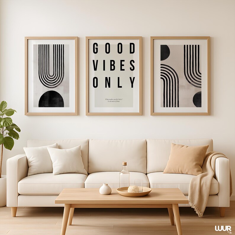 Minimalist black abstract line art print featuring a curved U-shaped geometric design on a soft beige background. This modern neutral wall art is part of a set of 3 prints perfect for Scandinavian, Japandi, and contemporary home decor. Ideal for living rooms, dining areas, entryways, and offices. Printable wall art for instant download, adding a clean and stylish touch to any interior space.
