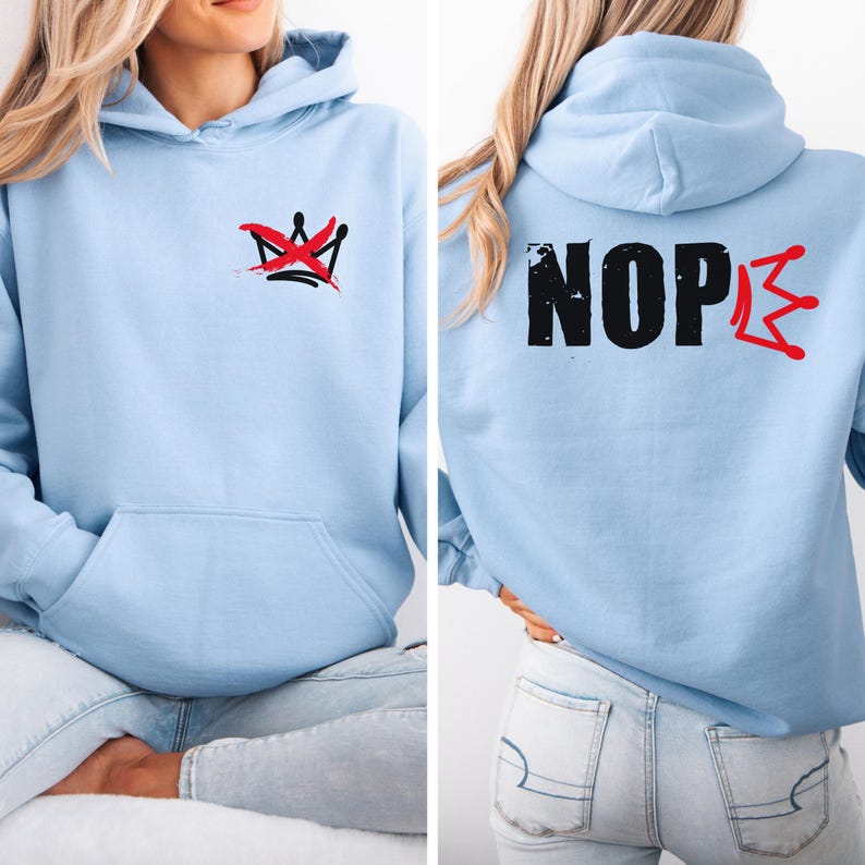 May include: Light blue hoodie with a front pocket and a hood. The front features a red and black crown design. The back of the hoodie displays the word "NOPE" in black with a red crown design. The hoodie is made of a soft material.