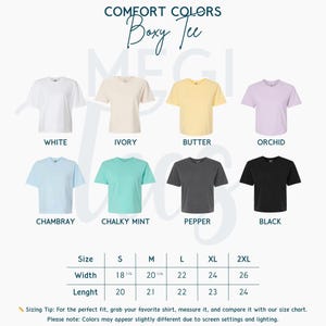 May include: A display of Comfort Colors Boxy Tee shirts in various colors, including white, ivory, butter, orchid, chambray, chalky mint, pepper, and black. Size chart shows width from 18 1/4 to 26 inches and length from 20 to 24 inches.