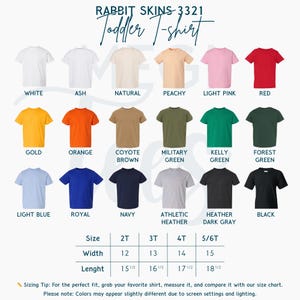May include: A selection of toddler t-shirts in various colors, including white, red, and blue. The image displays a size chart with measurements in inches. Text on the image reads "Rabbit Skins 3321 Toddler T-shirt."