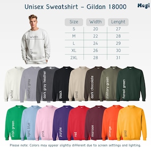 Puede incluir: Una selecci&oacute;n de sudaderas unisex en varios colores, incluyendo blanco, negro y verde bosque. La imagen muestra una tabla de tallas y un modelo con una sudadera blanca. El texto dice "Unisex Sweatshirt - Gildan 18000."
