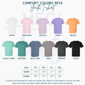 May include: A display of Comfort Colors 9018 Youth T-shirts in various colors, including white, pink, purple, and orange. The image also shows a size chart with measurements in inches for width and length, ranging from YS to YXL.
