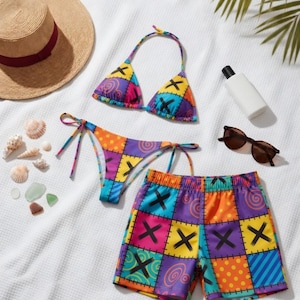Puede incluir: Un conjunto de bikini patchwork colorido con un pantalón corto a juego, un sombrero de paja con una banda burdeos, gafas de sol y protector solar. El conjunto de traje de baño presenta una vibrante mezcla de colores y patrones.