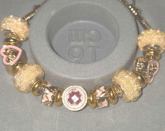 Gold coloured pandora style heart bracelet