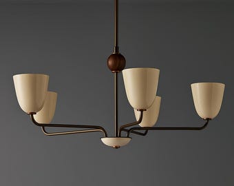 May include: A modern chandelier with five cream-colored, tulip-shaped shades. The fixture has a dark bronze finish with a wooden sphere accent. The arms extend horizontally from a central stem.