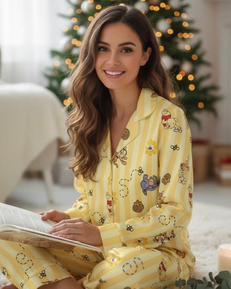 Step into comfort and nostalgia with this Winnie the Pooh Pajama Set featuring Pooh Bear, Piglet, Tigger, and Eeyore — surrounded by buzzing bees and honey pots on a cheerful yellow-striped satin background. Perfect for cozy nights, family lounging, or gifting any Disney lover 🍯🐝.