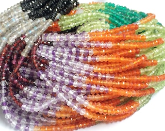 May include: A collection of faceted gemstone beads in various colors, including black, clear, red, purple, orange, green, and yellow. The beads are strung together, creating a textured and colorful display. Ideal for jewelry making.