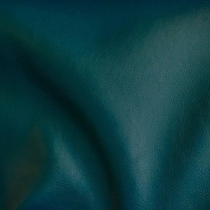 May include: A close-up of a teal leather fabric with a textured surface.