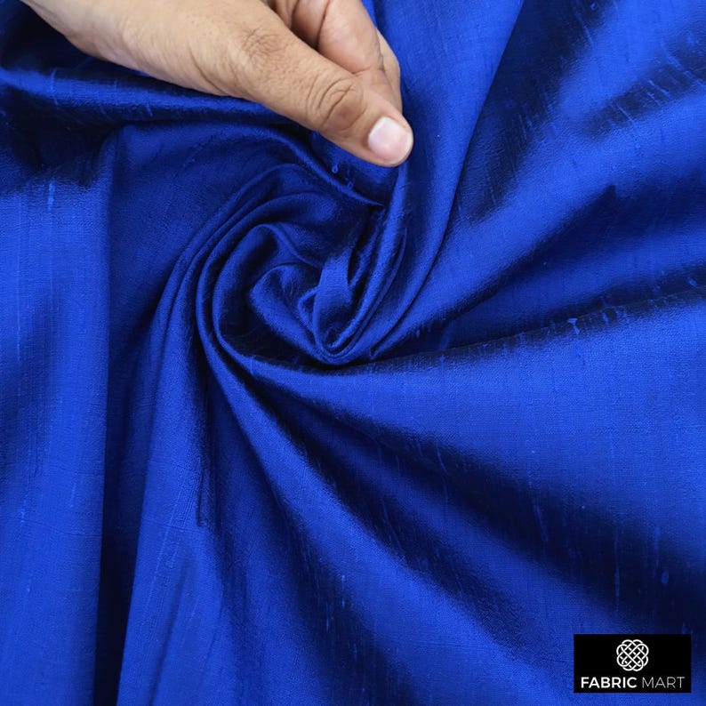 May include: Royal blue silk fabric with a subtle sheen. The fabric is smooth and drapes beautifully.
