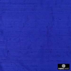 May include: A close-up of a solid royal blue fabric with a subtle woven texture. The fabric has a smooth, silky feel.