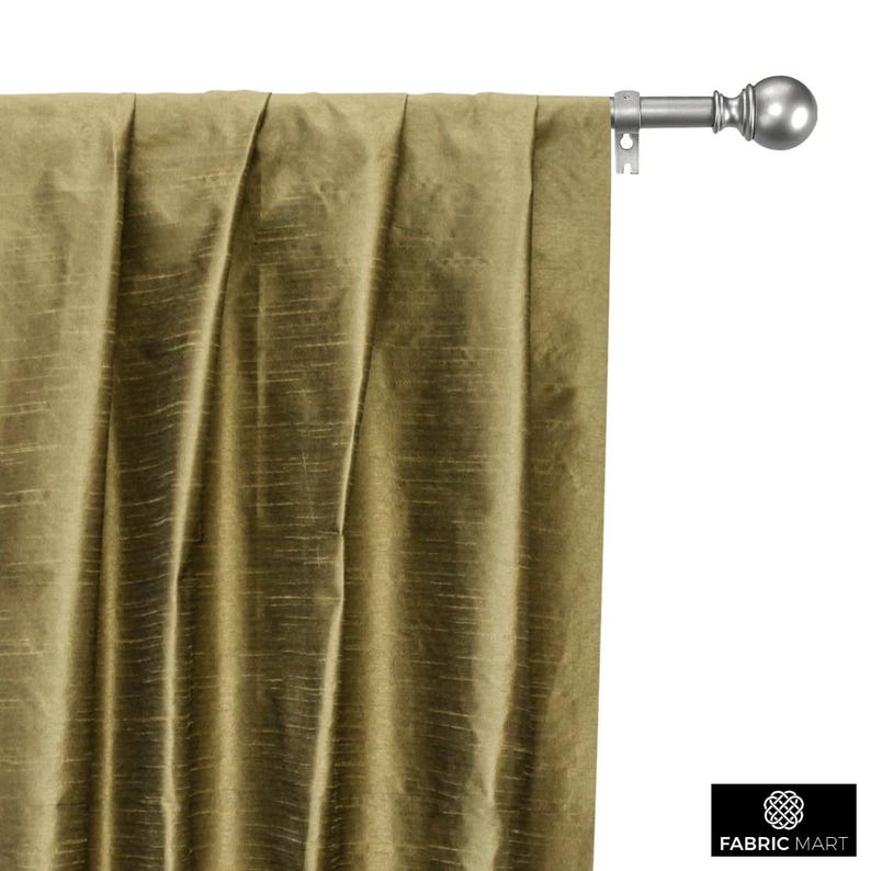 May include: A pair of olive green curtains with a subtle sheen, hanging from a silver curtain rod with a finial.