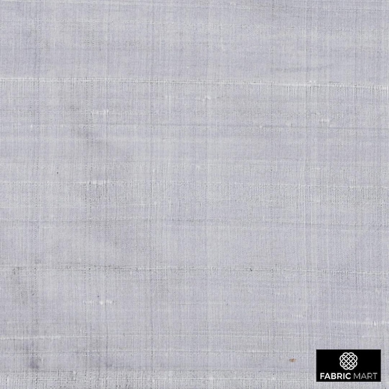 May include: A close-up of a light gray fabric with a subtle woven texture. The fabric has a smooth, silky feel and a slightly iridescent sheen.