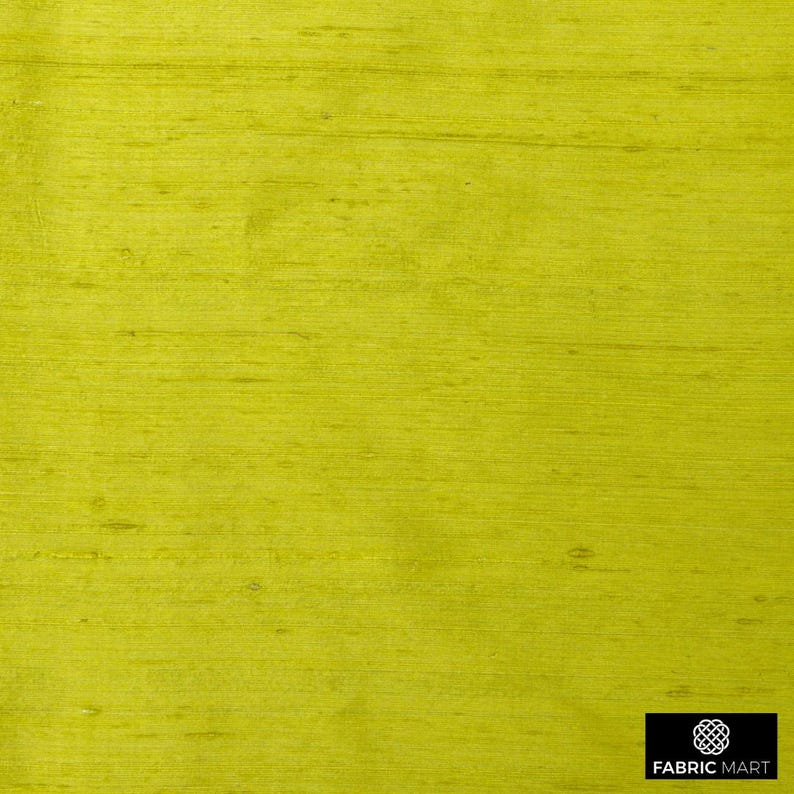 May include: A close-up of a bright yellow fabric with a subtle woven texture. The fabric has a smooth, silky feel.