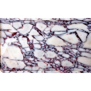May include: Rectangular tray with a marble design. The tray features a pattern of white and burgundy-coloured stone fragments, creating a mosaic effect. The edges of the tray are smooth and polished.