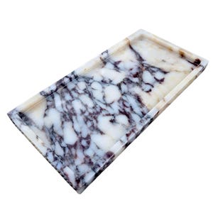 May include: Rectangular marble tray with a raised edge. The tray features a white base with dark purple and gray veining throughout. The edges are a light beige color.