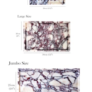 May include: Three rectangular marble trays in varying sizes: small (13cm x 26cm), large (20cm x 30cm), and jumbo (25cm x 45cm). The trays display a white and purple veined pattern and have a raised edge.