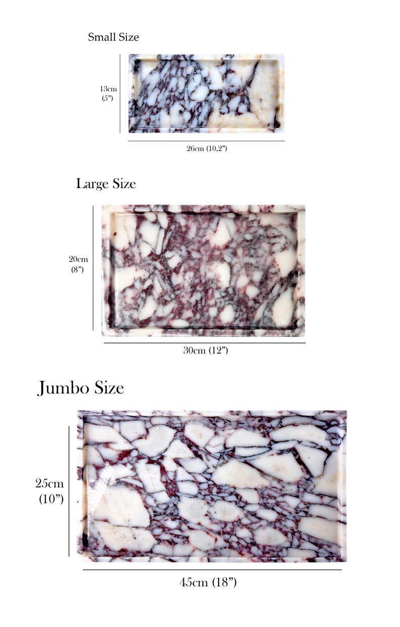 May include: Three rectangular marble trays in varying sizes: small (13cm x 26cm), large (20cm x 30cm), and jumbo (25cm x 45cm). The trays display a white and purple veined pattern and have a raised edge.