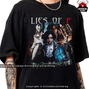 May include: Black t-shirt featuring the title "Lies of P" above a graphic of characters from the video game. The design includes a central figure in a blue coat, surrounded by other characters in white and dark attire. The Etsy shop name is visible.