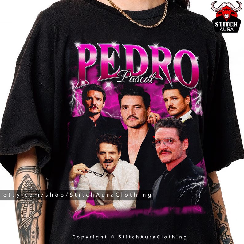 May include: Black t-shirt featuring a graphic of Pedro Pascal with the name "PEDRO" in pink, and "Pascal" below. The design includes multiple images of the actor with a pink lightning bolt background. The Etsy shop URL and copyright information are at the bottom.