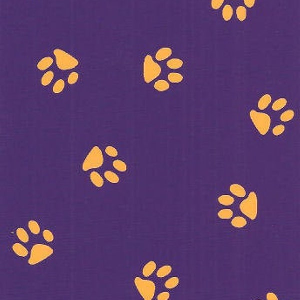 Tossed Gold Paws on Purple Cotton Fabric by Fabric Finders