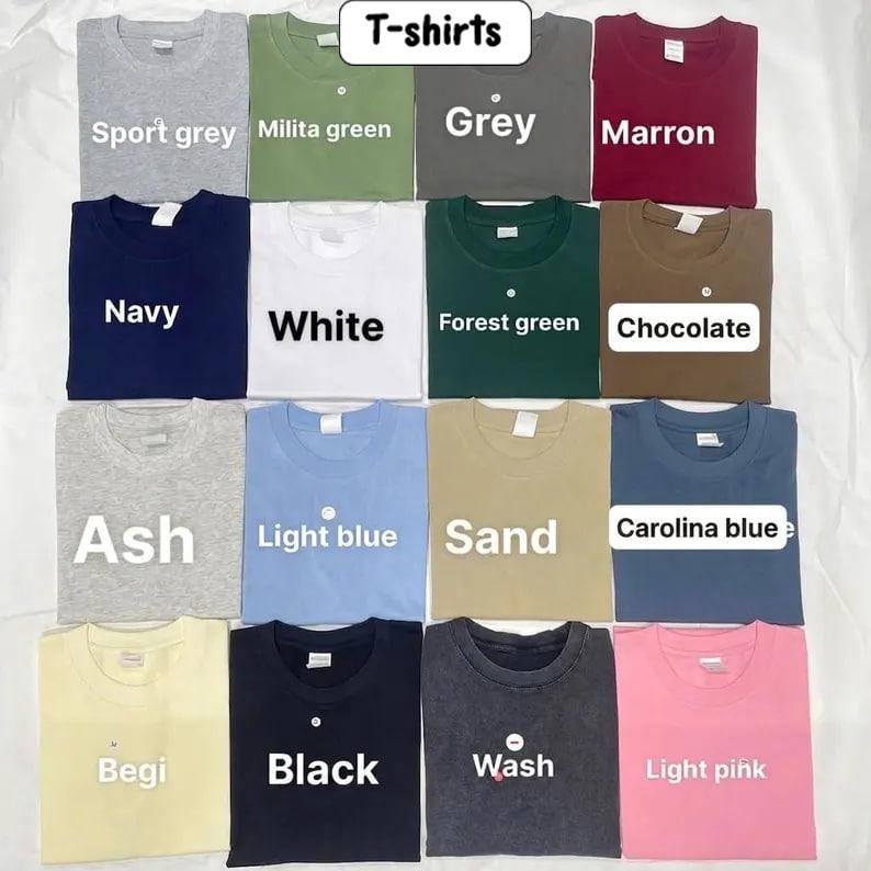 May include: A collection of sixteen crew neck t-shirts arranged in a grid, featuring various solid colors including sport grey, military green, grey, maroon, navy, white, forest green, chocolate, ash, light blue, sand, carolina blue, begi, black, wash, and light pink.
