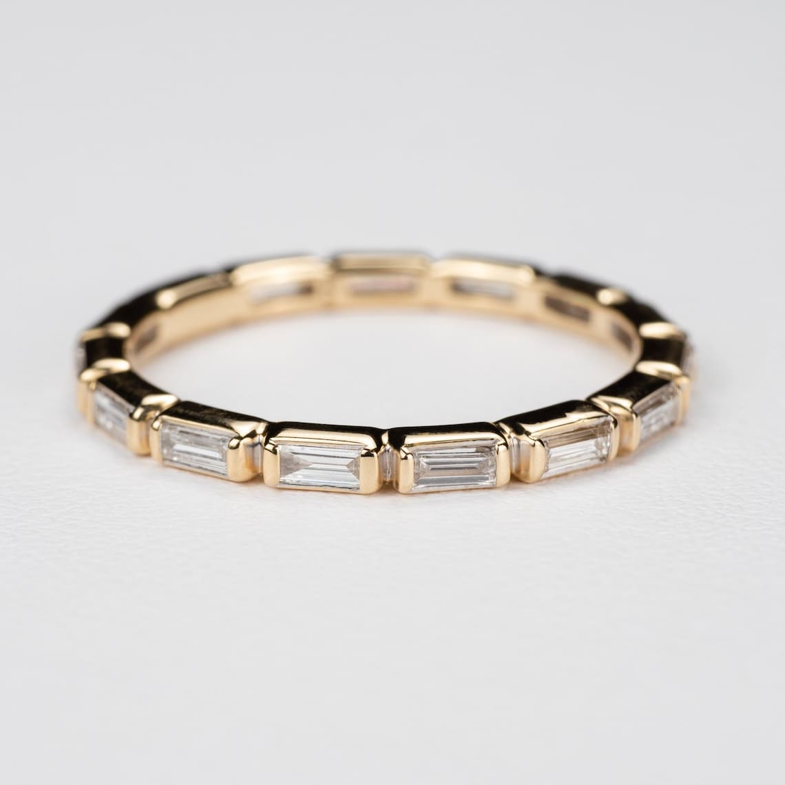 Baguette Diamond Bezel Eternity Band: Elian  Available in image 1