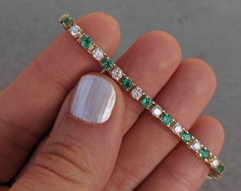 Diamond and Emerald Tennis Bracelet. 5 carats. 14k Yellow, Rose & White Gold. Box Clasp with Figure Eight Locking Hinge