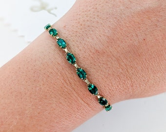 8.6ct Oval Emerald Tennis Bracelet - Claw prong gemstone line bracelet. Available in 14k, 18k and Platinum. Fully customizable.