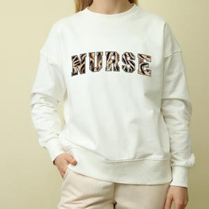 Nurse Unisex Sweatshirt, RN Gift, Medical Staff Apparel, Healthcare Worker Pullover, Hospital Scrubs Top