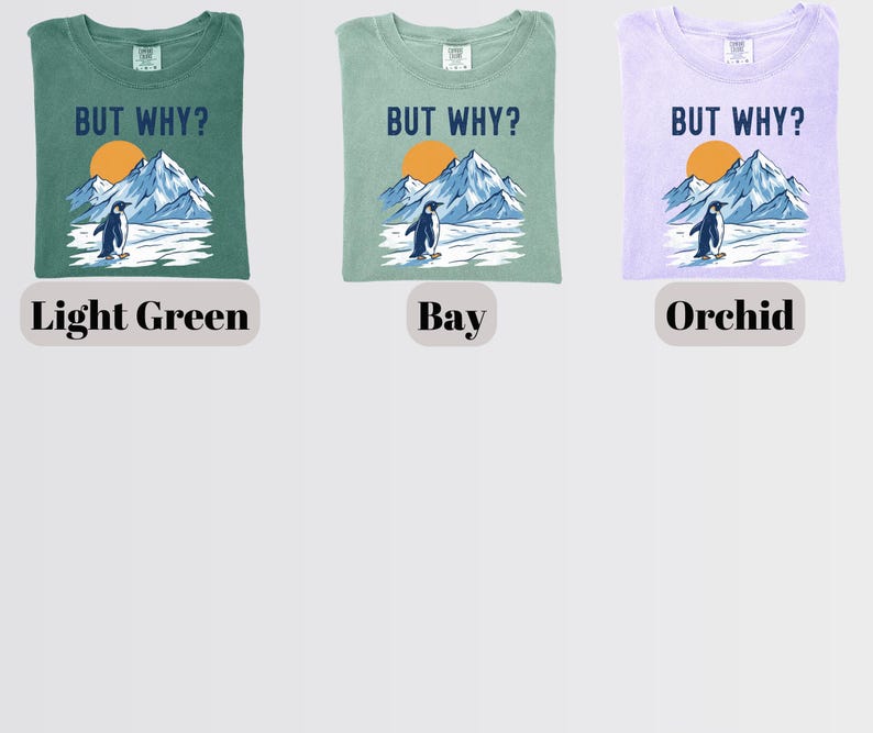 May include: Three t-shirts in light green, bay, and orchid colors. Each shirt features a graphic of a penguin standing in front of mountains and a sun, with the text "BUT WHY?" above the graphic. The shirts are labeled "Light Green", "Bay", and "Orchid".