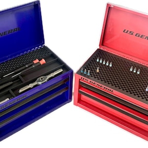 May include: Two open toolboxes, one blue and one red, each with the text "U.S. GENERAL" on the lid. The blue toolbox contains screwdrivers and a wrench. The red toolbox holds various small tools. Both have black interiors.