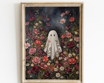 May include: A framed wall art print featuring a white ghost figure centred amidst a dense garden of dark red, pink, and white flowers against a deep navy blue background. The artwork is enclosed in a light-coloured, weathered wooden frame.