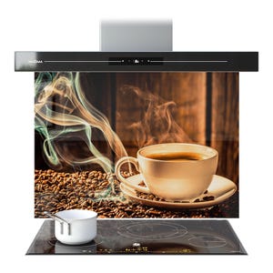 May include: A black range hood with a glass splashback showing a coffee cup on a saucer, surrounded by coffee beans and steam. A white saucepan sits on a black hob. The hood has the word "PRISMA" on it.