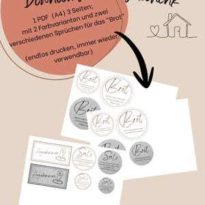 May include: A digital download featuring three A4 pages of printable labels for housewarming gifts. The sheets include circular and rectangular designs with German text such as Brot, Salz, and Angekommen, presented in two color variations.