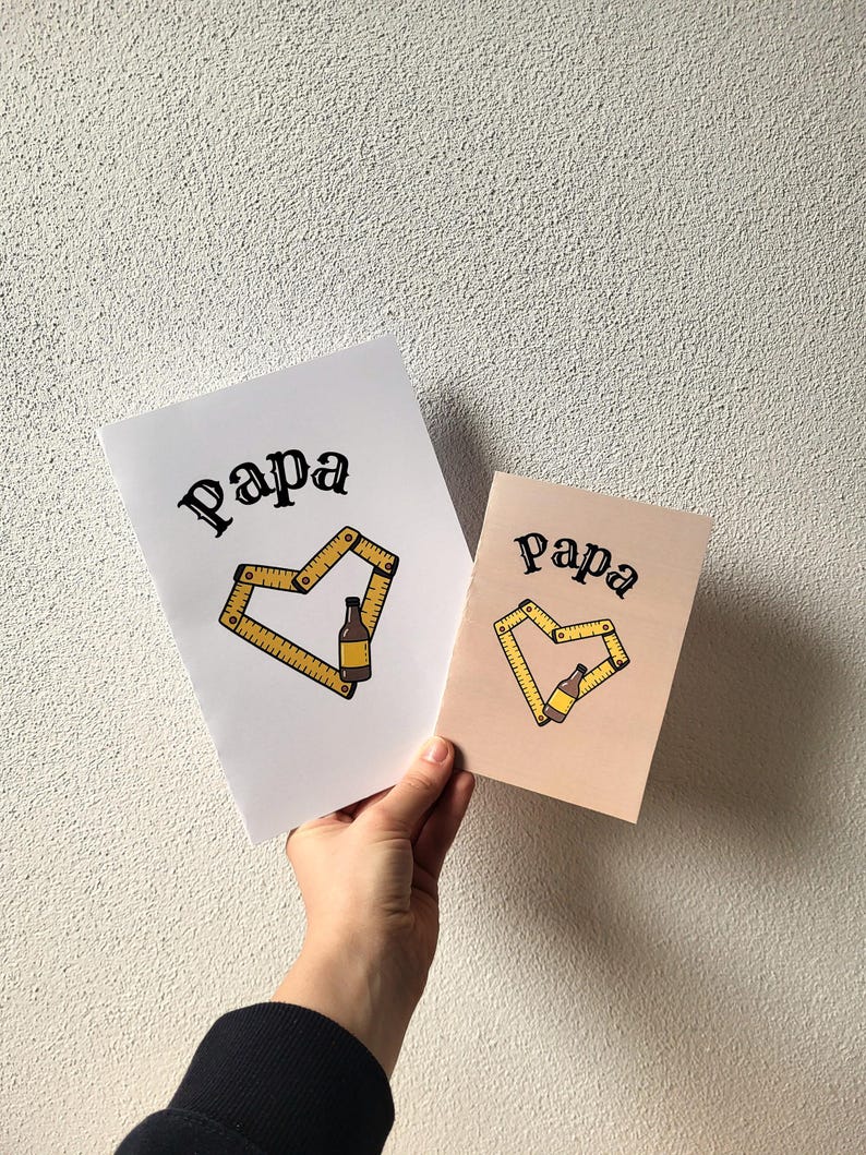 May include: Two cards with the word "Papa" in a script font. One card is white, the other is light brown. Each card features a yellow heart design made of a folding ruler and a beer bottle.