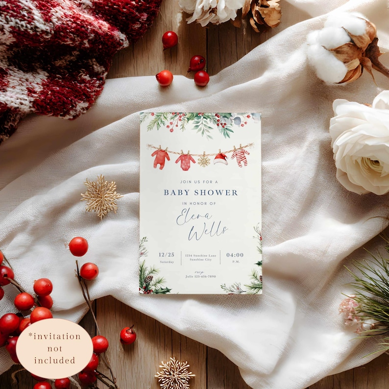 May include: A baby shower invitation with a festive design. The card features watercolor illustrations of baby clothes and a Santa hat hanging on a string. The text reads "Join us for a Baby Shower" and includes the name "Elena Wells".