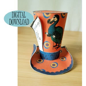 May include: A printable papercraft hat featuring a dodo bird from Alice in Wonderland. The hat is orange with blue and yellow accents. The dodo bird is blue and green with a long beak and is holding a stick.