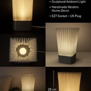 May include: A 3D-printed designer lamp with a white, textured shade and a dark gray base. The lamp is 28 cm tall and emits a warm, ambient light. The image includes text that reads "Luxury 3D Printed Designer Lamp."