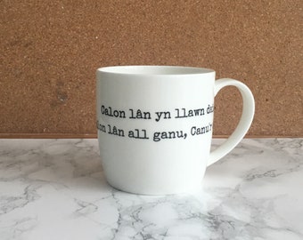 Calon Lan bone china mug with red dragon illustration- welsh language