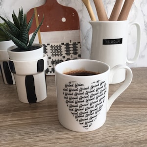 Ffrind friend in Welsh. Black writing script heart shape  bone china mug