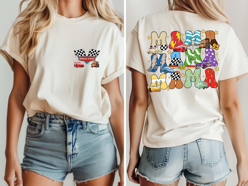 May include: Cream-colored t-shirt featuring a front pocket design with checkered flags, a red race car, and a brown truck. The back of the shirt displays the word "MAMA" in colorful, car-themed letters, with the number "95".