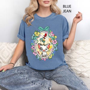 Celebrate Disney magic with our Floral Hei Hei Pua Coquette Bow Shirt featuring adorable Moana characters with a feminine twist. This Comfort Colors® tee showcases Hei Hei and Pua surrounded by floral accents and a cute coquette bow, making it perfect for Disney fans. Great for Disney World trips, Disneyland vacations, or everyday Disney love. A charming and trendy tee for girls trips, family vacations, or Moana lovers of all ages.