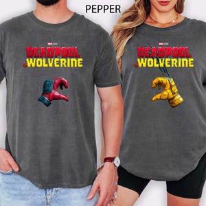 This Marvel tee features Deadpool and Wolverine in a bold “Love Come Together” design—perfect for MCU fans, Marvel couples, or anyone hyped for Deadpool 3. A fun and edgy superhero shirt for comic lovers, geeky couples, or Deadpool LFG energy!