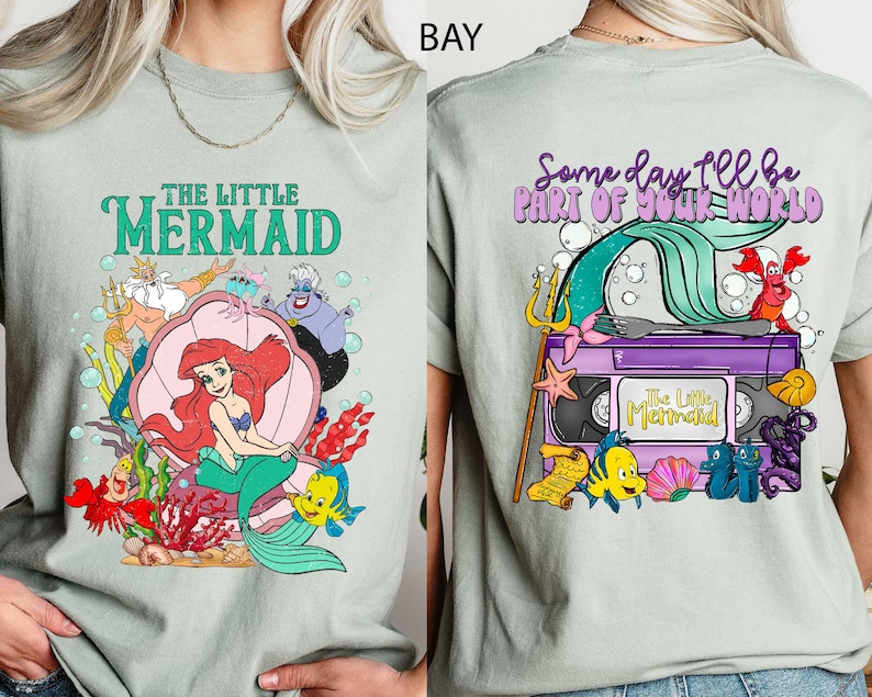 This vintage-style Little Mermaid tee features two-sided artwork of Princess Ariel, printed on soft Comfort Colors fabric. Perfect for Disney girls’ trips, Magic Kingdom park days, or fans of nostalgic princess fashion. With dreamy pastels and a retro vibe, it's ideal for Disneyland adventures.